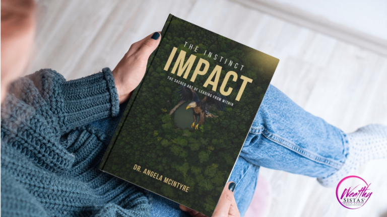 Reader holding The Instinct Impact: The Sacred Art of Leading from Within by Dr. Angela McIntyre, published by Wealthy Sistas Publishing House — a transformational book on mindful, purpose-driven leadership.